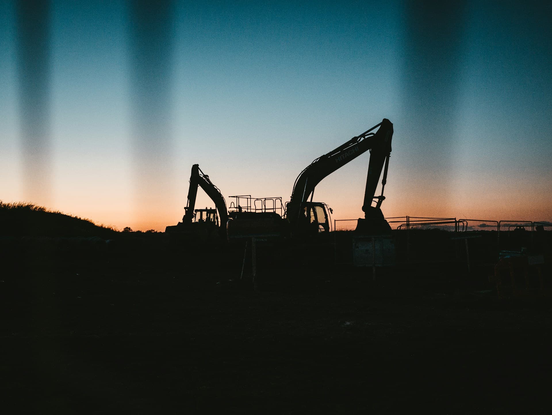 Heavy equipment silhouette at sunset